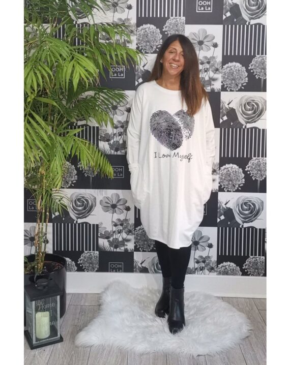 This oversized dress features I Love Myself logo with heart. Two large front pockets in a sweatshirt material and slight Hi Lo. This will definitely become your go to piece.